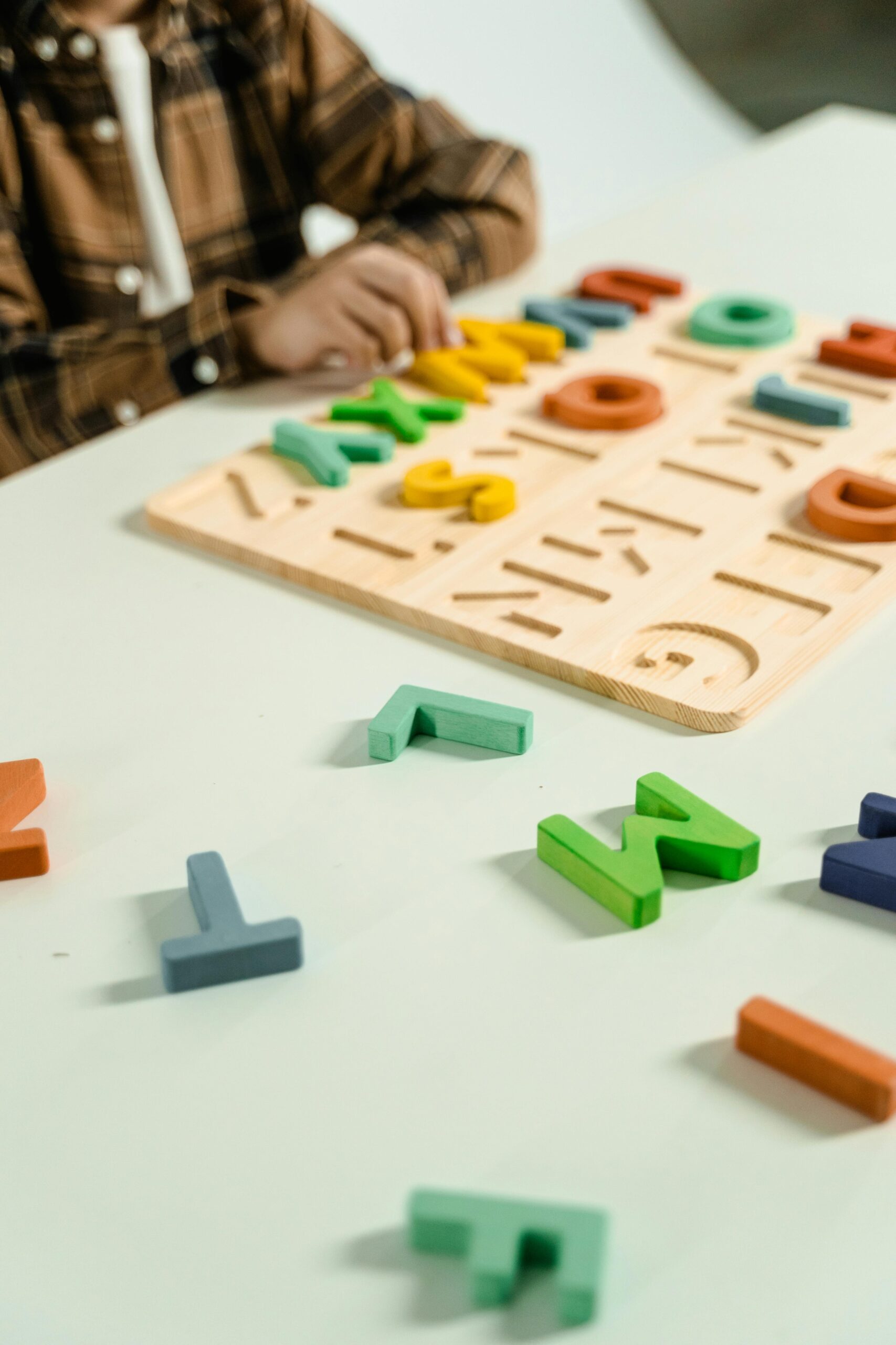 Colorful wooden alphabet letters for preschool children's learning and creativity.